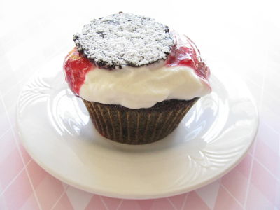 Berry and cream capped cupcake